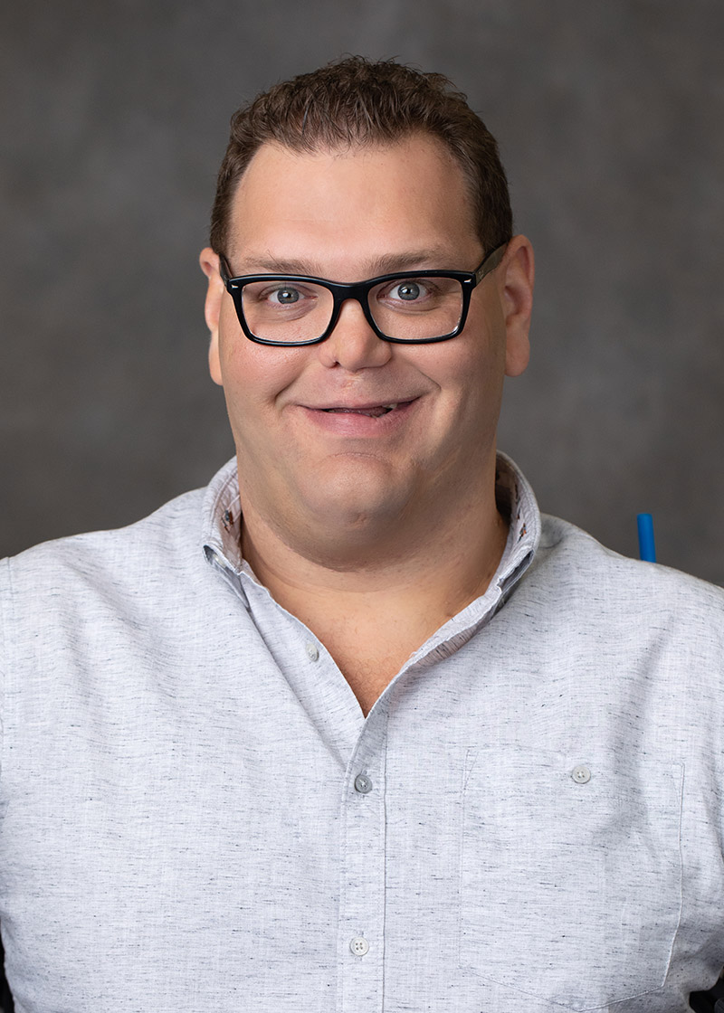 Portrait of Kyle Romano, writer and Disability Rights activist